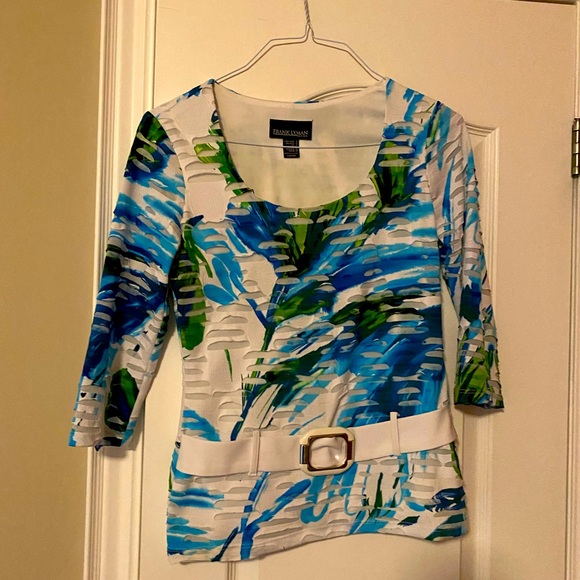 Frank Lyman design. Funky top with attached belt in the front